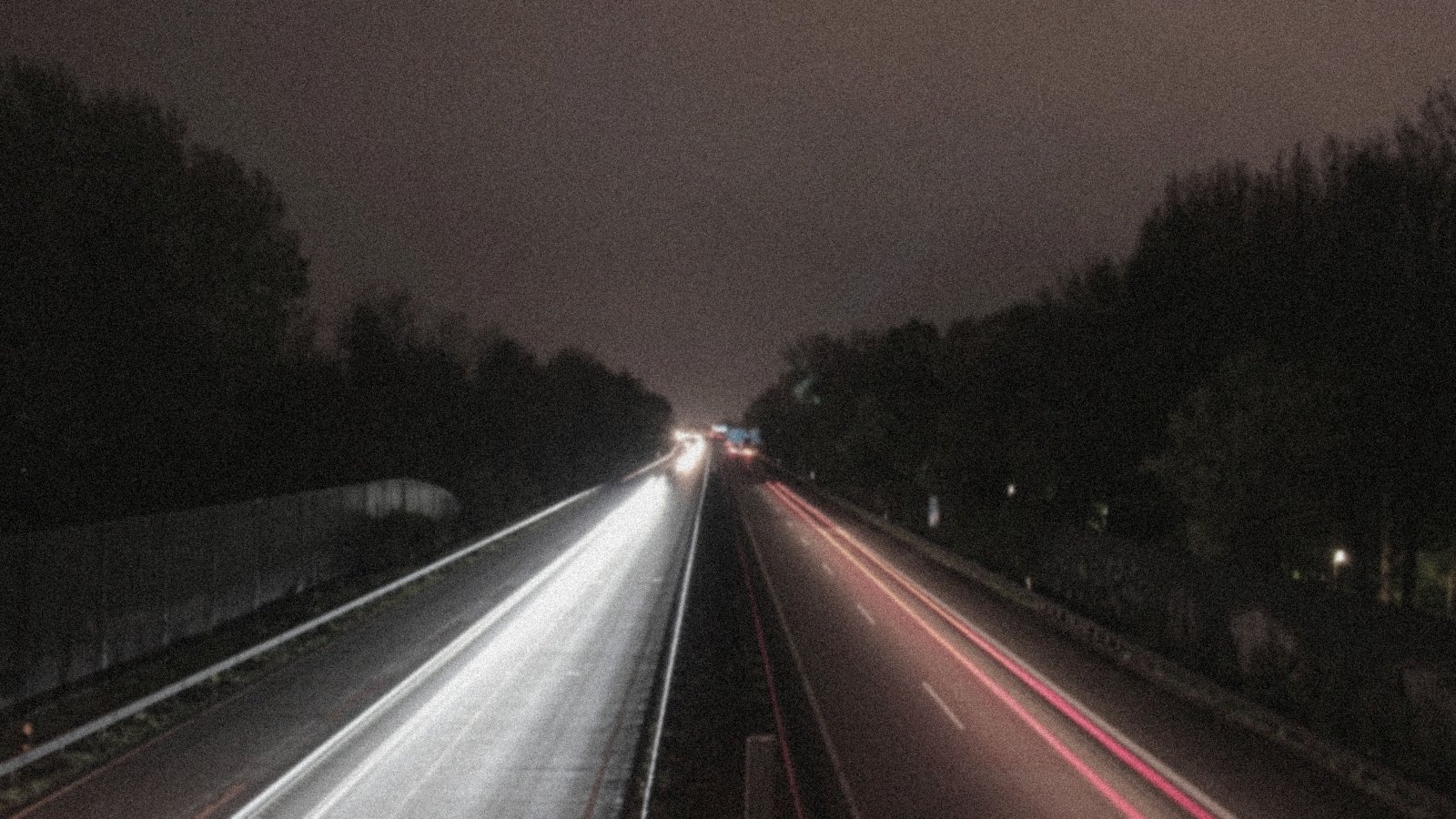 A highway disappearing into mist
