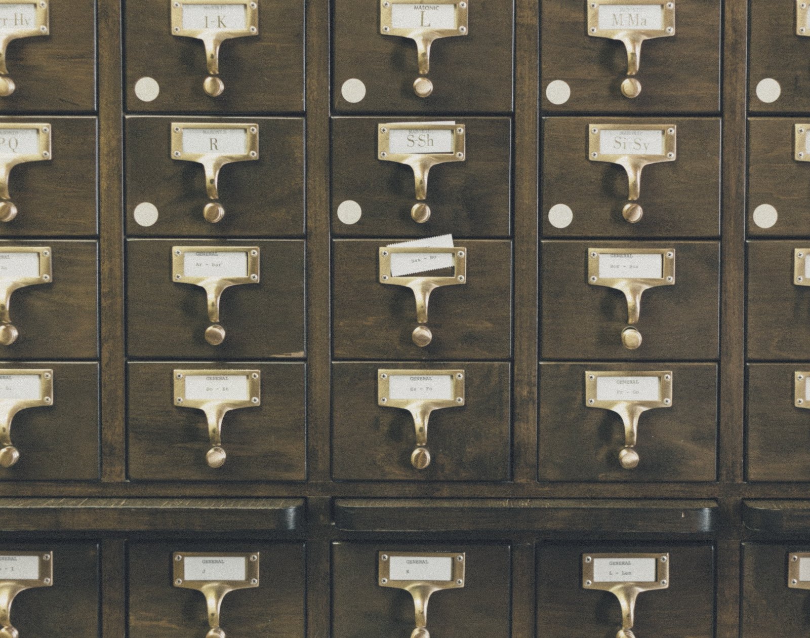 Brass handles on a wooden card catalogue