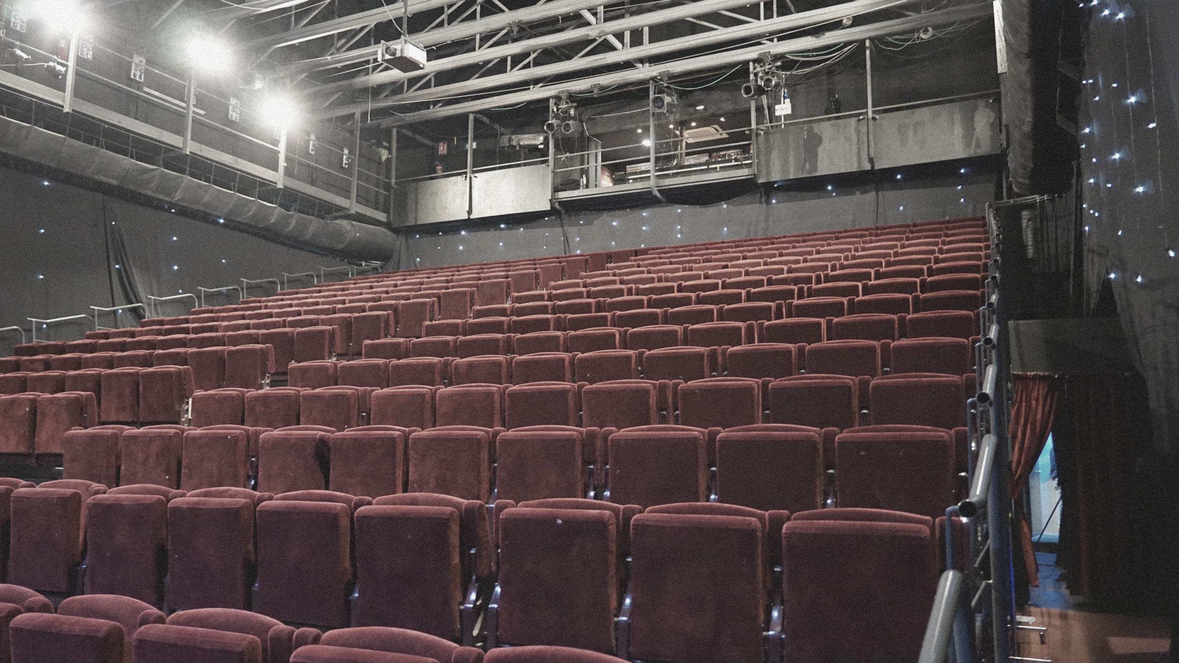 Rows of red velvet theatre seats