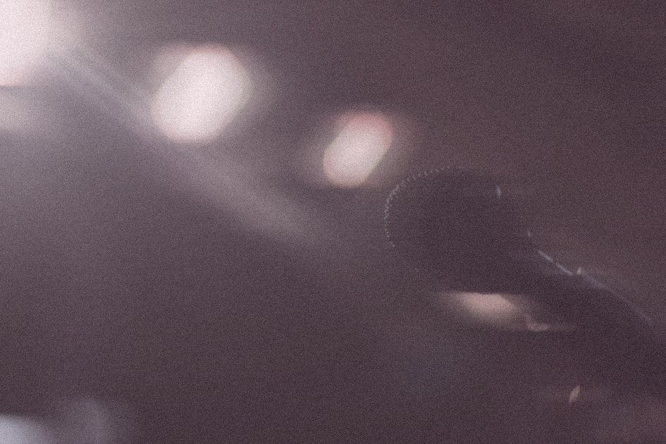 A microphone in dusky pink light