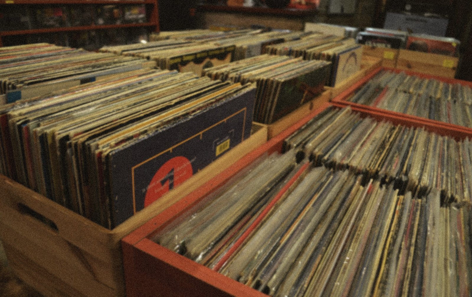 Wooden crates packed with records in a record shop